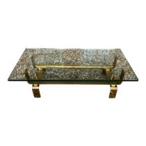 A VINTAGE HEAVY POLISHED BRASS COFFEE TABLE With plate glass top. (100cm x 60cm x 30cm)