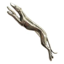 A STERLING SILVER GREYHOUND BROOCH With impressed mark verso. (7cm x 1.5cm) Condition: good