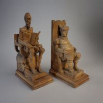 A PAIR OF EARLY 20TH CENTURY SPANISH CARVED WOODEN BOOKENDS CARVED AS DON QUIXOTE AND SANCHO PANZA