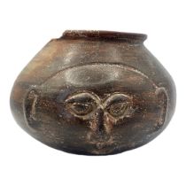A SOUTH AMERICAN TERRACOTTA POTTERY MASK/VASE Bulbous form with incised mask. (approx 16cm)