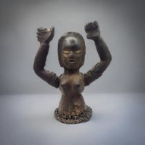 AN AFRICAN EKOI TRIBE LEATHER FIGURE Female form, with both arms raised and woven leather straps