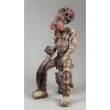 A RARE BAMILEKE CHIEF ORNATE BEADED STATUE. This wonderful statue is of a Chief with his crown sat