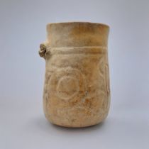 A SOUTH AMERICAN TERRACOTTA POTTERY VASE Having a single mask and incised decoration. (approx