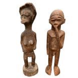 TWO AFRICAN GHANA CARVED WOODEN FERTILITY FIGURES Male and female in standing pose. (approx 36cm)