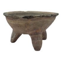 A SOUTH AMERICAN POTTERY CONICAL TRIPOD BOWL Hand painted with concentric rings on tripod legs. (