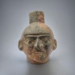 A SOUTH AMERICAN TERRACOTTA POTTERY FACE MASK JUG Spout form finial with mask to body. (approx 18cm)