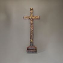A 19TH CENTURY CARVED WOODEN CRUCIFIX Having a glass bead mount and carved decoration. (approx 32cm)