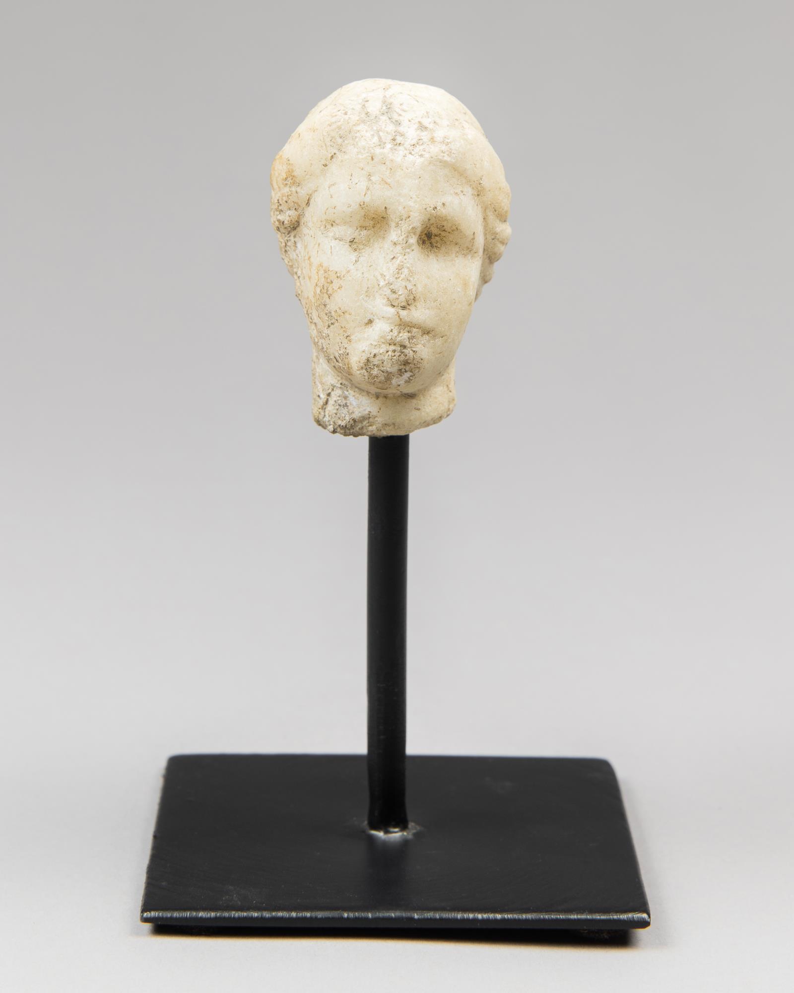 A FRAGMENTARY MARBLE HEAD OF A GODDESS. Probably Greek, circa 1st – 2nd century AD - Image 2 of 2