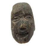 A 19TH CENTURY CONTINENTAL CARVED WOODEN HEAD Elongated form with carved features. (approx 20cm x