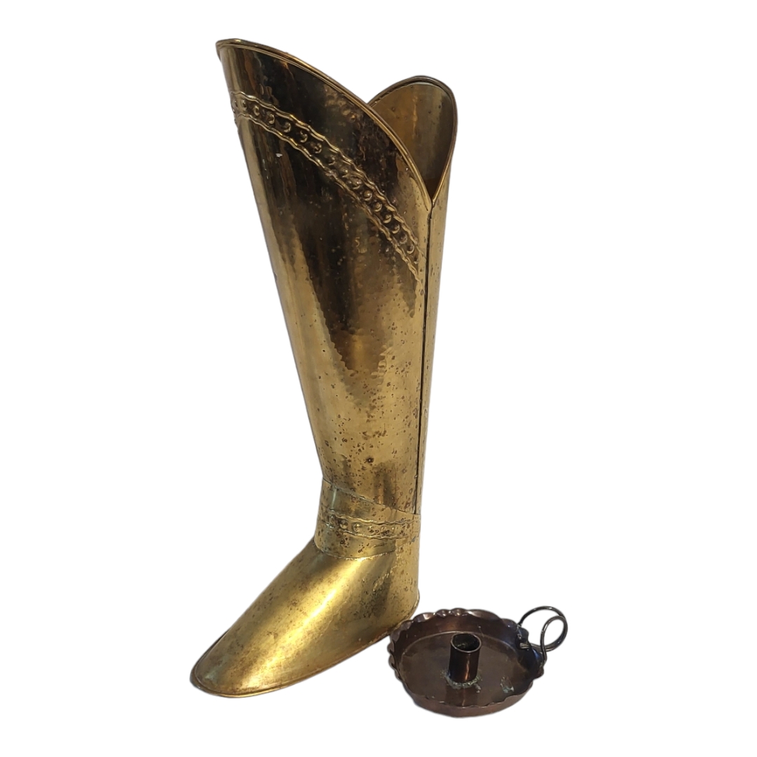 A BRASS BOOT STICK STAND Along with an Arts and Crafts copper chamber stick. (tallest 55cm)