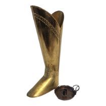 A BRASS BOOT STICK STAND Along with an Arts and Crafts copper chamber stick. (tallest 55cm)