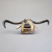 AN AFRICAN CARVED WOODEN TABWA BULL MASK Protruding horns and ears, painted decoration and bell to