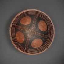 A SOUTH AMERICAN TERRACOTTA POTTERY BOWL Hand painted decoration with egg form designs to centre. (