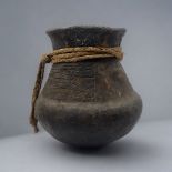 A SOUTH AMERICAN BLACKWARE POTTERY VASE Bulbous form with incised decoration and rope twist