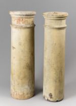 A LATE 19TH/EARLY 20TH CENTURY NEAR PAIR OF PAINTED WOODEN PLINTHS. (h 80cm)