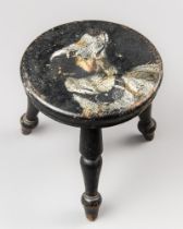 AN UNUSUAL SMALL 19TH CENTURY EBONISED STOOL WITH DOG PAINTING TO THE SEAT, ON THREE SPLAYED