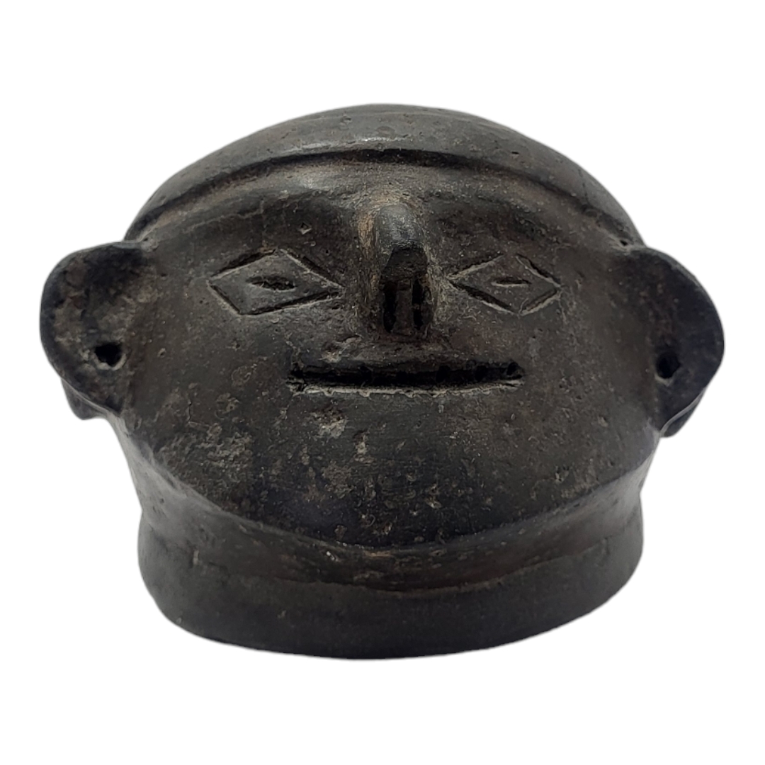 A SOUTH AMERICAN BLACKWARE POTTERY MASK BOWL Having pierced holes to ears and incised facial