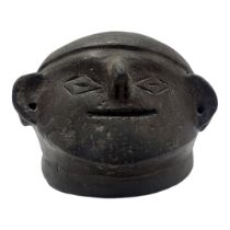 A SOUTH AMERICAN BLACKWARE POTTERY MASK BOWL Having pierced holes to ears and incised facial