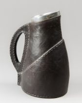 A LATE 19TH CENTURY DOULTON LAMBETH LEATHER JACKET TANKARD WITH STERLING SILVER RIM. Silver