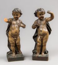 A PAIR OF 17TH/18TH CENTURY FINELY POLYCHROME PAINTED WOODEN PUTTI. (h 21.5cm). Note: The original