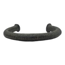 A LARGE TRIBAL AFRICAN BRONZE CURRENCY NECKLACE Having hammered flattened ends and engraved