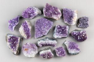 A LARGE COLLECTION OF AMETHYST CRYSTAL GEODE CLUSTERS. Largest (13.5cm)