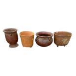 A COLLECTION OF FOUR SOUTH AMERICAN POTTERY BOWLS Two with handles and two with tripod legs. (