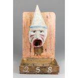 AN EARLY 20TH CENTURY PAINTED PAPIER-MÂCHÉ FRENCH FAIRGROUND PASSÉ-BOULES BALL TOSS GAME. In the
