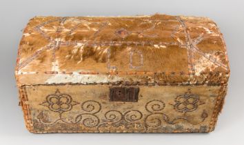 AN UNUSUAL EARLY 18TH CENTURY PONY HIDE COVERED TRUNK, BRASS STUDDED WITH INITIALS L.D. AND DATE