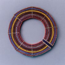 AN AFRICAN TRIBAL MAASAI BEADWORK COLLAR The arrangement of colourful glass beads forming concentric