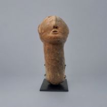 AN AFRICAN TERRACOTTA BURA TRIBE FUNERARY SCULPTURE Carved facial features on tapering base. (approx
