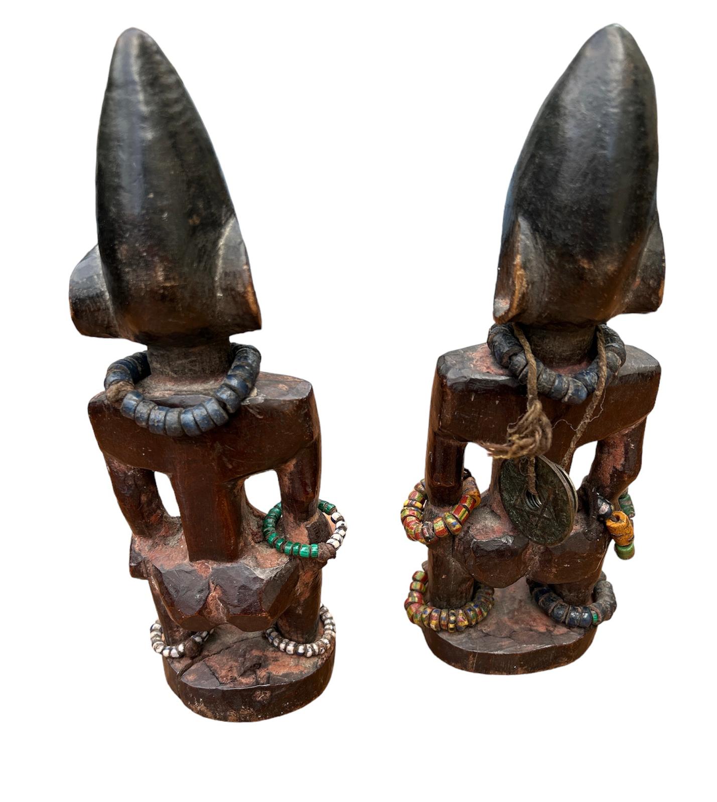 A PAIR OF AFRICAN YORUBA CARVED WOODEN FERTILITY FIGURES Male and female with steel nails to eyes - Image 2 of 2