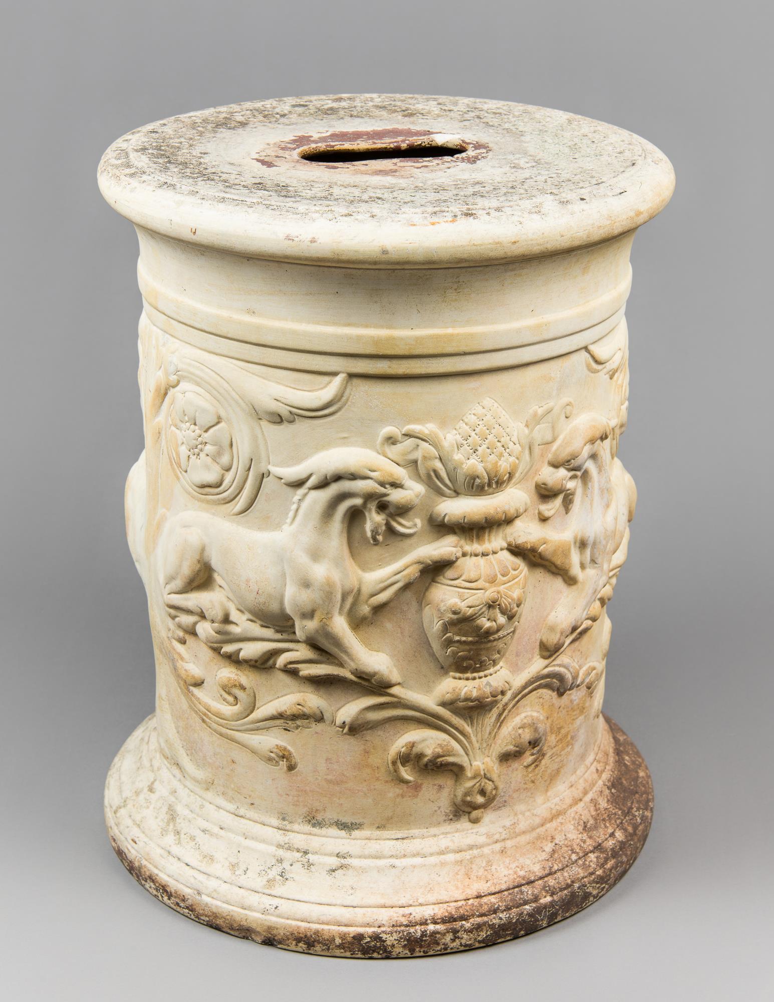 AN ANTIQUE TERRACOTTA PEDESTAL WITH DECORATIVE RELIEF. (h 40cm x w 31cm x d 31cm)