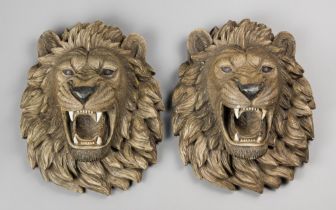 A PAIR OF LATE 20TH CENTURY LION HEAD WALL PLAQUES. Composite. (h 40cm x w 32cm x d 23cm)