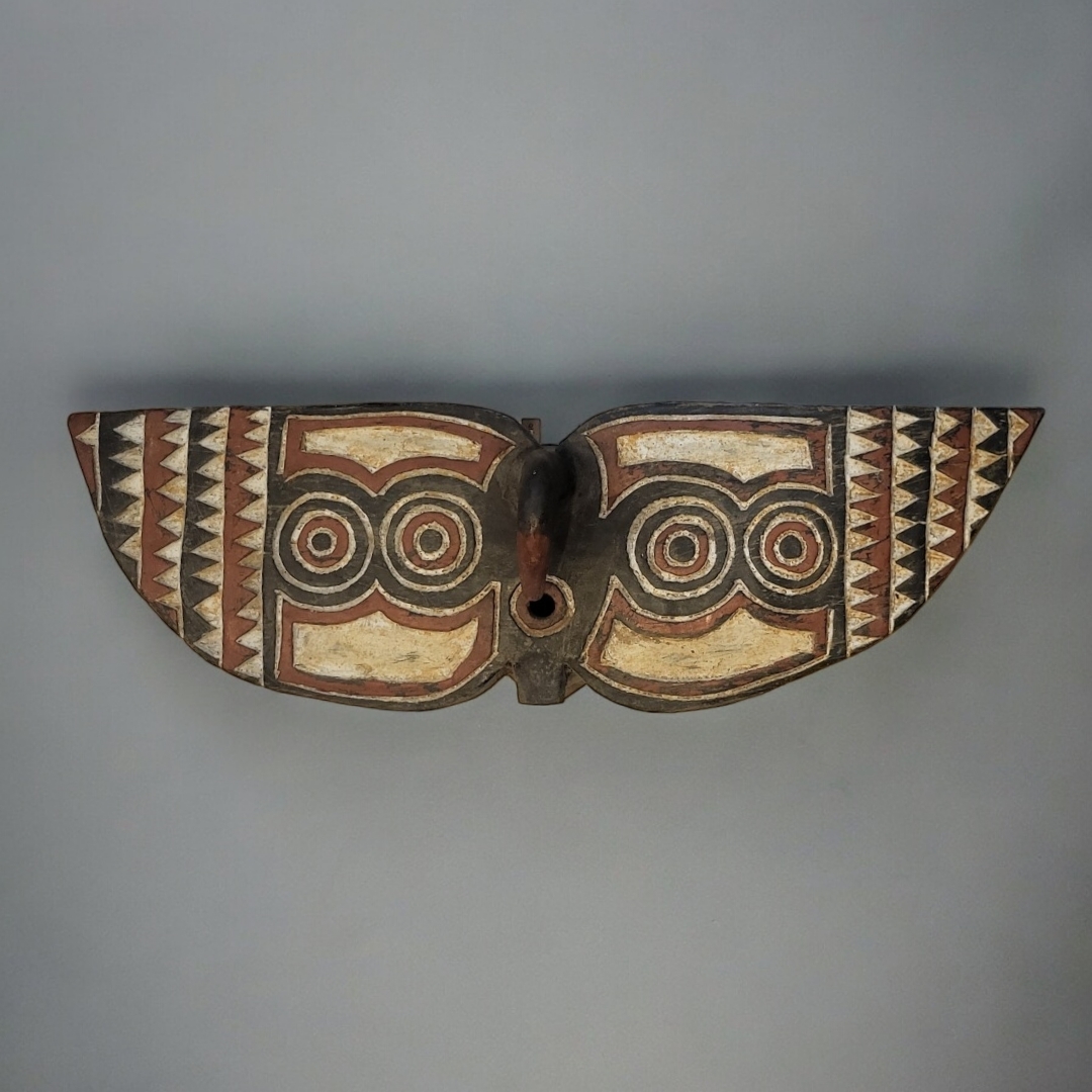 AN AFRICAN TRIBAL CARVED BWA 'BUTTERFLY 'MASK Carved decoration in red and black palette. (approx