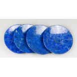 A SET OF FOUR LAPIS LAZULI PLATES (25.5cm x 25.5cm).