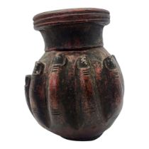 AN INDIAN 'HAND OF BUDDHA' POTTERY VASE Two handset base and with traces of painted decoration. (