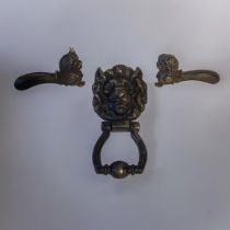 A PAIR OF 19TH CENTURY CAST IRON LION MASK DOOR HANDLES Opposing lions with flutes to handle,