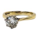 A VINTAGE 18CT GOLD AND 1.25CT DIAMOND SOLITAIRE RING The single round cut diamond set in a plain
