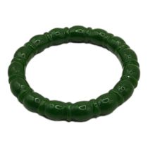 A SPINACH GREEN JADE NEPHRITE BANGLE With a ribbed design. (inside diameter 6cm) Condition: good