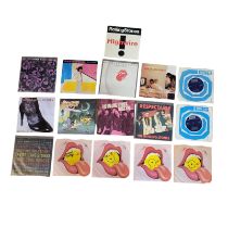 THE ROLLING STONES, A FOLDER OF SIXTEEN 7” VINYL SINGLES Including Honky Tonk Women, Undercover of