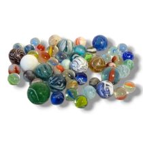 A MIXED COLLECTION OF FIFTY-TWO GLASS MARBLES Consisting of some Victorian Nailsea glass marble