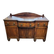 A REGENCY PERIOD MAHOGANY SIDE CABINET AND EBONY LINE INLAY With three drawers above cupboards, on