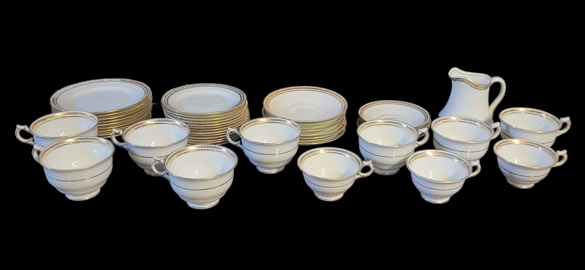 GEORGE JONES FOR HARRODS, A VINTAGE PORCELAIN TEA SET Having a classical form border, comprising