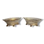 A PAIR OF 19TH CENTURY CONTINENTAL PORCELAIN BASKETS Lozenge form with pierced and gilded