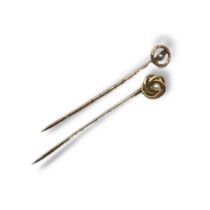 A VICTORIAN 15CT GOLD AND SEED PEARL STICK PIN The single pearl in a rope twist design,together with