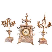 A 19TH CENTURY GILT BRASS AND ROUGE MARBLE CLOCK GARNITURE SET Having a scrolled finial, twin