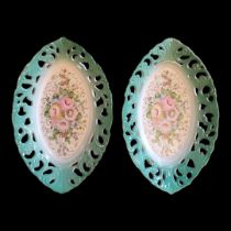 A PAIR OF SEVRÈS STYLE CERAMIC OVAL DISHES having a central floral decoration and pierced acanthus