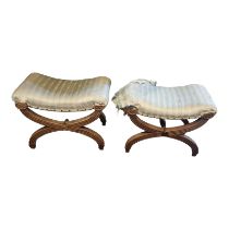 A PAIR OF REGENCY MAHOGANY STOOLS The overstuffed upholstered seats on reeded cross legs. (61cm x