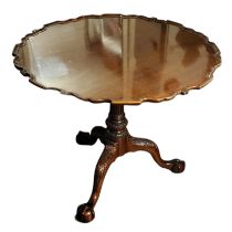 AN 18TH CENTURY STYLE SOLID MAHOGANY TILT TOP SUPPER TABLE With piecrust moulded top and bird